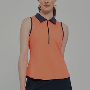 Lija Sunset Polo. Electric Orange/Navy. Size Small. New.The Sunset Polo is a c